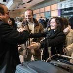 Ali Reza Jalili (left) greeted his niece Helia Jalili at Logan Airport on Sunday.