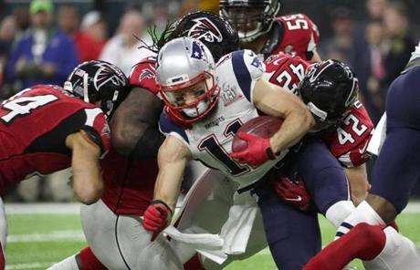 PAT SLIDER 7 Houston, Feb. 5, 2017 - Julian Edelman gang tackled in the first quarter. The Atlanta Falcons play the New England Patriots in Super Bowl LI at NRG Stadium in Houston on Feb. 5, 2017. Barry Chin / Globe staff.

