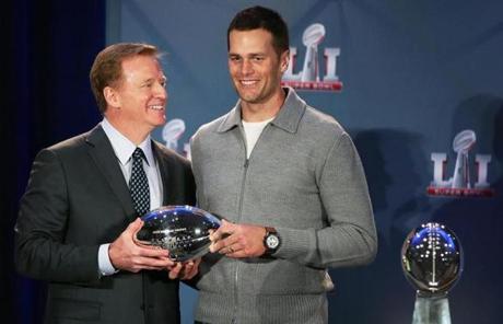 Houston, TX Feb. 6 2017: On the morning following their come from behind Super Bowel victory, New England Patriots quarterback Tom Brady and head coach Bill Belichick were present at a press conference along with NFL commissioner Roger Goodell. Brady (right) accepted the Super Bowl MVP award from Goodell (left). The Vinced Lombardi Trophy is at right. (Globe Staff Photo/Jim Davis) reporter: various topic: Super Bowl
