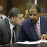 Aaron Hernandez (left) and his attorney looked over a list of questions that may be asked to prospective jurors in the case. 