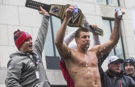 Boston, MA - 2/7/2017 - New England Patriots tight end Rob Gronkowski holds up beers during the New England Patriots' Super Bowl Parade in Boston, MA, February 7, 2017. (Keith Bedford/Globe Staff)

