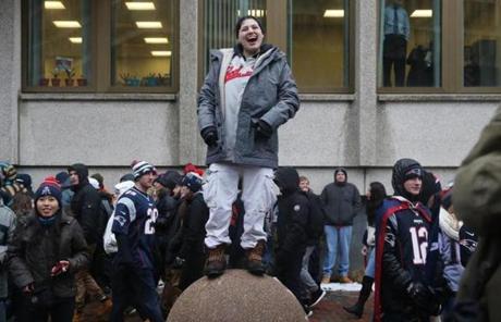 Boston, MA- February 07, 2017: Haley Ferragamo found a high vantage point for the rally that followed the New England Patriots Super Bowl LI victory parade in Boston, MA on February 07, 2017. (Globe staff photo / Craig F. Walker) section: metro reporter: New England Patriots Super Bowl Parade 2017 boston globe staff 
