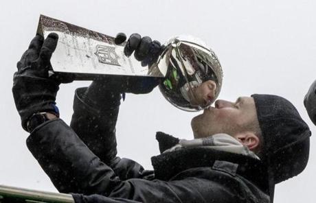 Tom Brady kisses the Vince Lombardi Trophy.
