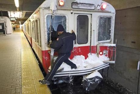 QUINCY, MA - 2/09/2017: A conductor changes position from rear to dront of train crosssing over snow covered platform. STORM hits Boston area a day after temperatures hit 52 degrees.(David L Ryan/Globe Staff Photo) SECTION: METRO TOPIC stand alone photo
