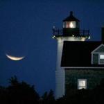 Woods Hole, MA 08/28/07 Lunar eclipse over Nobska Lighthouse in Woods Hole MA. (Bill Greene/ Globe Staff) section:metro Library Tag 05312009 Travel - New England