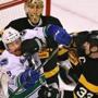 Boston-02/11/2017 Boston Bruins vs Vancouver Canucks- Bruins Zdeno Chara tries to clear the front of the net as he gets a glove into the face of Canucks Jack Skille in the 1st period as Bruins goalie Anton Khudobin looks over them. JohnTlumacki/Globe Staff (sports)