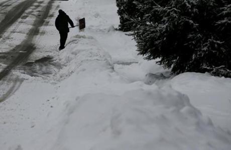 Carl Schwartz shoveled in Newton on Saturday. 
