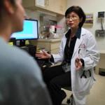 Dr. Lin H. Chen consulted a patient at Mt. Auburn Hospital, where she is the director of the Travel Medicine Clinic.