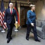 Vice President Mike Pence and German Chancellor Angela Merkel met Saturday at the Munich Security Conference. 