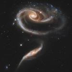 A Hubble Space Telescope image of a group of interacting galaxies called Arp 273. Recent measurements of the distances and velocities of faraway galaxies don?t agree with a hard-won ?standard model? of the cosmos that has prevailed for the past two decades.