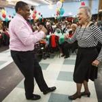 Boston, MA - 2/21/2017 - Lois Epps, 87, dances with Tracy Litthcut(L), 54, during the 4th annual Black History Month Senior Celebration at Prince Hall in Boston, MA, February 21, 2017. (Keith Bedford/Globe Staff)