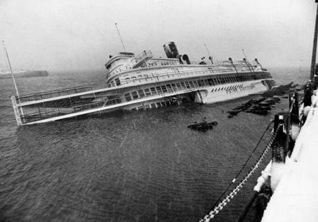 The SS Peter Stuyvesant tilted on its side as a result of fierce winds during the Blizzard of 1978.
