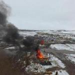 epa05809556 A handout photo made available by the North Dakota Joint Information Center shows an aerial view of burning structures in Oceti Sakowin camp, Morton County, North Dakota, USA, 22 February 2017. Authorities began the removal of protesters opposing the Dakota Access Pipeline (DAPL) from the camp after the expiration of an evacuation deadline ordered by state and federal authorities. Protesters reportedly set some fires to destroy teepees and other abandoned dwellings as they left the camp during the eviction. The camp, located on federal land near the Standing Rock Sioux Reservation, was illegally set to protest the nearby Dakota Access Pipeline, media added. EPA/NORTH DAKOTA JOINT INFORMATION CENTER HANDOUT HANDOUT EDITORIAL USE ONLY/NO SALES