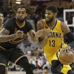 Indiana Pacers' Paul George (13) drives past Cleveland Cavaliers' Derrick Williams (3) in the second half of an NBA basketball game, Wednesday, Feb. 15, 2017, in Cleveland. (AP Photo/Tony Dejak)