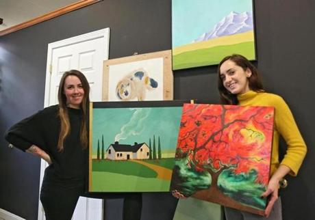 Amanda Abbott (left) and Leonie Little-Lex are among a group of local artists who sold more than $4,000 of watercolors, ceramics, prints, and jewelry to benefit Greater Boston Legal Services and the Refugee & Immigrant Assistance Center.
