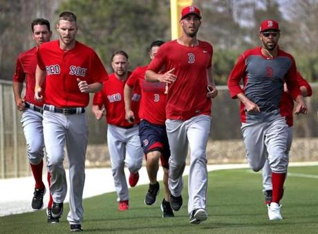 Fort Myers, FL - 2/14/2017 - Boston Red Sox pitchers Chris Sale, Rick Porcello, and David Price end their workout with a run. Red Sox Spring Training. Day Two. Pitchers and catchers first workout at Jet Blue Park in Fort Myers, FL. - (Barry Chin/Globe Staff), Section: Sports, Reporter: Peter Abraham, Topic: 14Res Sox, LOID: 8.3.1634172896.
