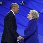 President Barack Obama and Democratic Presidential candidate Hillary Clinton hold hands on stage after the president addressed the delegates during the third day session of the Democratic National Convention in Philadelphia, on July 27, 2016. (AP Photo/Carolyn Kaster)