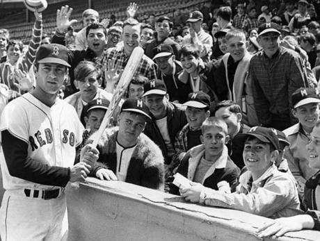 Boston, MA - 4/29/1967: Boston Red Sox player Carl Yastrzemski poses with some of the children attending the Globe Baseball Clinic in Boston on April 29, 1967. (Dan Goshtigian/Globe Staff) --- BGPA Reference: 170216_MJ_006
