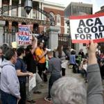 Health professionals joined a rally outside the State House to save the federal health law.