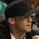 Julian Edelman wore a white shirt and black hat and was in the front row at the Celtics game Monday night. 