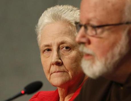 FILE - In this May 3, 2014 file photo, Cardinal Sean O'Malley, the archbishop of Boston, right, and Marie Collins attend a press conference at the Vatican. Collins, an Irish woman who was sexually abused by clergy, has quit in frustration her post on a Vatican commission advising Pope Francis about how to fight abuse of minors, Wednesday, March 1, 2017. (AP Photo/Riccardo De Luca)
