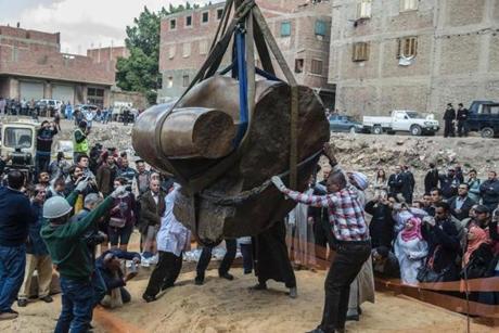 Egyptian workers excavated the statue, recently discovered by a team of German-Egyptian archeologists, in Cairo's Mattarya district on Monday. 
