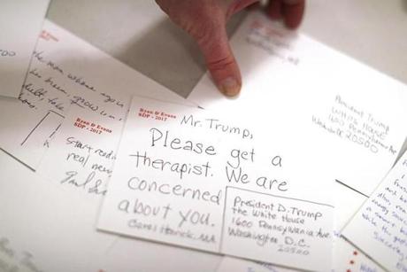 People filled out postcards to President Donald Trump at the First Parish Church in Watertown. 
