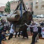 Egyptian workers excavated the statue, recently discovered by a team of German-Egyptian archeologists, in Cairo's Mattarya district on Monday. 