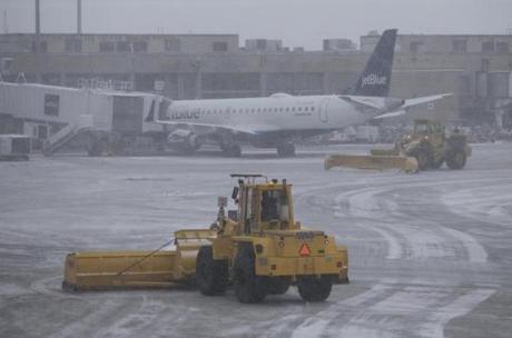 Snow plows kept the jetways clear at Logan Airport last month. 
