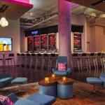 The bar at Aloft, a new hotel in the Seaport District, is a vibrant place to hang out.