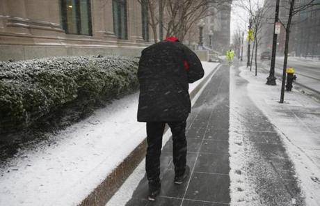 SNOW SLIDER 1 Boston, MA -- 3/14/2017 - A man hunched over to protect himself from the wind and snow as he walked along Clarendon Street in Boston. (Jessica Rinaldi/Globe Staff) Topic: 15storm Reporter: 
