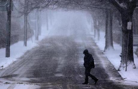 SNOW SLIDER 1 Brookline, MA - 03/14/17 - A pedestrian crosses Summit Avenue during heavy snowfall in Coolidge Corner. (Lane Turner/Globe Staff) Reporter: () Topic: (15storm)

