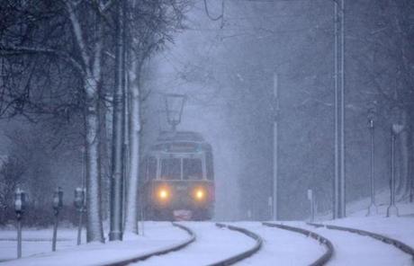 SNOW SLIDER 1 Brookline, MA - 03/14/17 - An MBTA Green Line C train heads inbound to Boston during heavy snowfall in Coolidge Corner. (Lane Turner/Globe Staff) Reporter: () Topic: (15storm)
