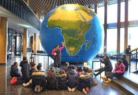 A huge, 20-foot inflatable globe was on display at Boston Public School headquarters in Dudley Square on Thursday, part of an effort to show students what the world really looks like.
Natacha Scott used this inflatable globe to explain the size of countries to students from The Nathan Hale School.
