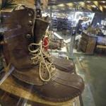 A early version of the Maine Hunting Shoe is displayed at the L.L. Bean flagship store in Freeport, Maine, Friday, March 17, 2017. The company reported a slight increase in sales for 2016 and said Friday that employees will be given a 3 percent annual bonus. The family-owned company said annual net sales last year were $1.6 billion. (AP Photo/Robert F. Bukaty)