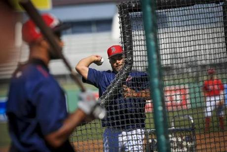 Boston Red Sox assistant hitting coach Victor Rodriguez throwing batting practice at jetBlue Park in Fort Myers, Fla. on Thursday, March 16, 2017. (Will Vragovic for The Boston Globe)

