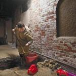 Boston, MA- March 17, 2017: City archeologist Joe Bagley excavates a unit during an archeological dig in the crypt of Old North Church in Boston, on March 17, 2017. Archeologists are digging in the centuries-old crypt of Old North Church, which wants to make the basement burial space accessible for public tours. (Globe staff photo / Craig F. Walker) section: metro reporter: 