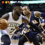 Boston Celtics' Jaylen Brown (7) drives past Indiana Pacers' Monta Ellis during the first quarter of an NBA basketball game in Boston, Wednesday, March 22, 2017. (AP Photo/Michael Dwyer)