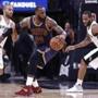 Cavaliers forward LeBron James (center) was held up by Spurs guard Tony Parker (left) in the first half. 