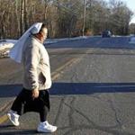 Sister Francoise Rasoarivao crossed Route 118 where the LaSalette Shrine hopes Attleboro will grant them a crosswalk.