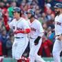 Boston-04/03/2017- Opening Day at Fenway Park- Red Sox played the Pirates- Sox Andrew Benintendi leads Sandy Leon and Dustin Peroia to the dugout after his 3-run homer in the 5th inning. John Tlumacki/Globe staff(sports)