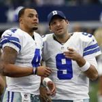 FILE - In a Sunday, Nov. 20, 2016 file photo, Dallas Cowboys' Dak Prescott (4) and Tony Romo (9) talk on the sideline in the first half of an NFL football game against the Baltimore Ravens in Arlington, Texas. The Cowboys went on a record-setting run without quarterback Romo, thanks to a pair of star rookies, Dak Prescott and Esekiel Elliott. (AP Photo/Michael Ainsworth, File)