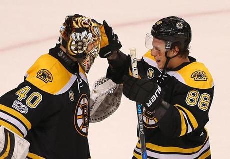 David Pastrnak (right) gave kudos to Tuukka Rask after the Bruins clinched a  playoff spot.
