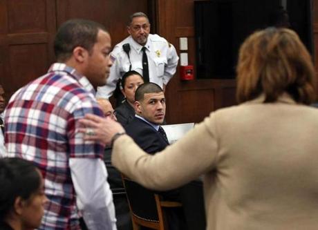 Former New England Patriots tight end Aaron Hernandez looked at defense attorney Linda Kenney Baden Wednesday. 
