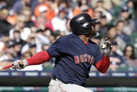 Boston Red Sox's Pablo Sandoval follows through on his three-run home run during the eighth inning of a baseball game against the Detroit Tigers, Friday, April 7, 2017, in Detroit. (AP Photo/Carlos Osorio)
