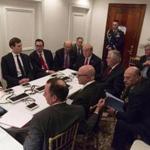In this image provided by the White House, President Donald Trump receives a briefing on the Syria military strike from his National Security team after the strike at Mar-a-Lago in Palm Beach, Fla., Thursday night, April 6, 2017. (White House via AP)