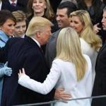 US President Donald Trump hugs his family after being sworn in as President on January 20, 2017 at the US Capitol in Washington, DC. / AFP PHOTO / Mark RALSTONMARK RALSTON/AFP/Getty Images