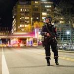 An officer stood guard as police cordoned off a large area around a subway station in Oslo, Norway.