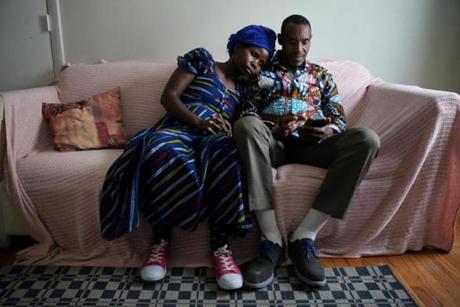 Vanisi Uzamukunda and her husband Sendegeya Bayavuge shared a quiet moment in their Lowell home.

