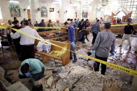 epa05899039 Security personnel investigate the scene of a bomb explosion inside Mar Girgis church in Tanta, 90km north of Cairo, Egypt, 09 April 2017. According to the Egyptian Health Ministry, at least 28 were killed and 71 injured in a bomb explosion at Mar Girgis Coptic church in the central delta city of Tanta during the Palm Sunday mass. EPA/KHALED ELFIQI ATTENTION EDITORS: PICTURE CONTAINS GRAPHIC CONTENT
